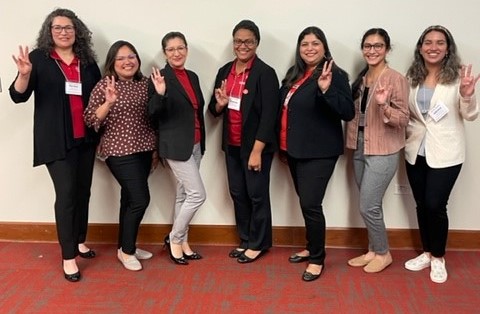 From left to right, Maria Honey, Judith Corral, Esmeralda Luna, Hope Pacheco, Esmeralda Valdez, Stephanie Perez-Gil, and Dr. Raven Jones at the Good Trouble: Ally Ship in Action Conference. 