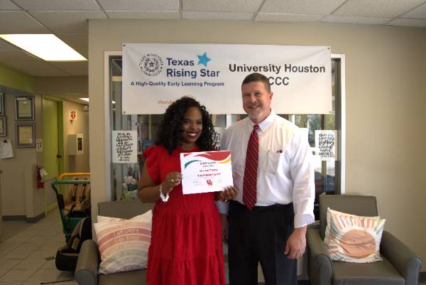 Shenae Champ (Left), Program Manager II for Children's Learning Center, pictured with Vice Chancellor/Vice President for Student Affairs, Dr. Paul Kittle.