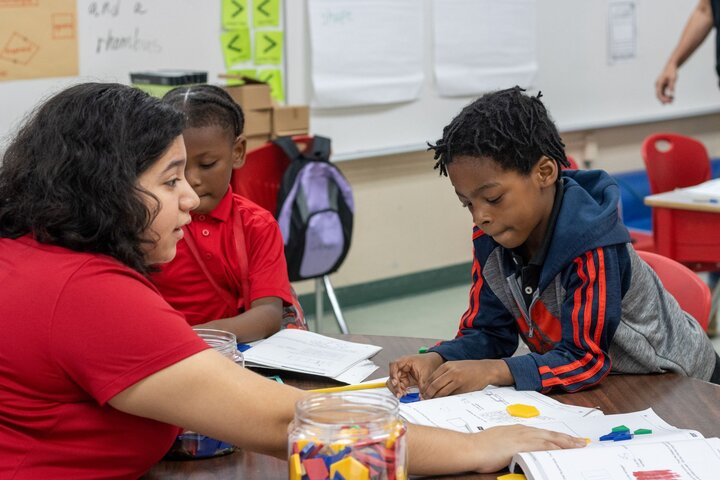Literacy tutor instructing elementary-aged students
