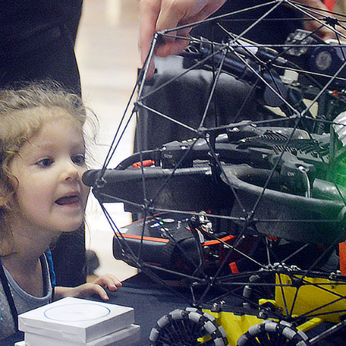 Attendees explore robotic exhibits at seminar