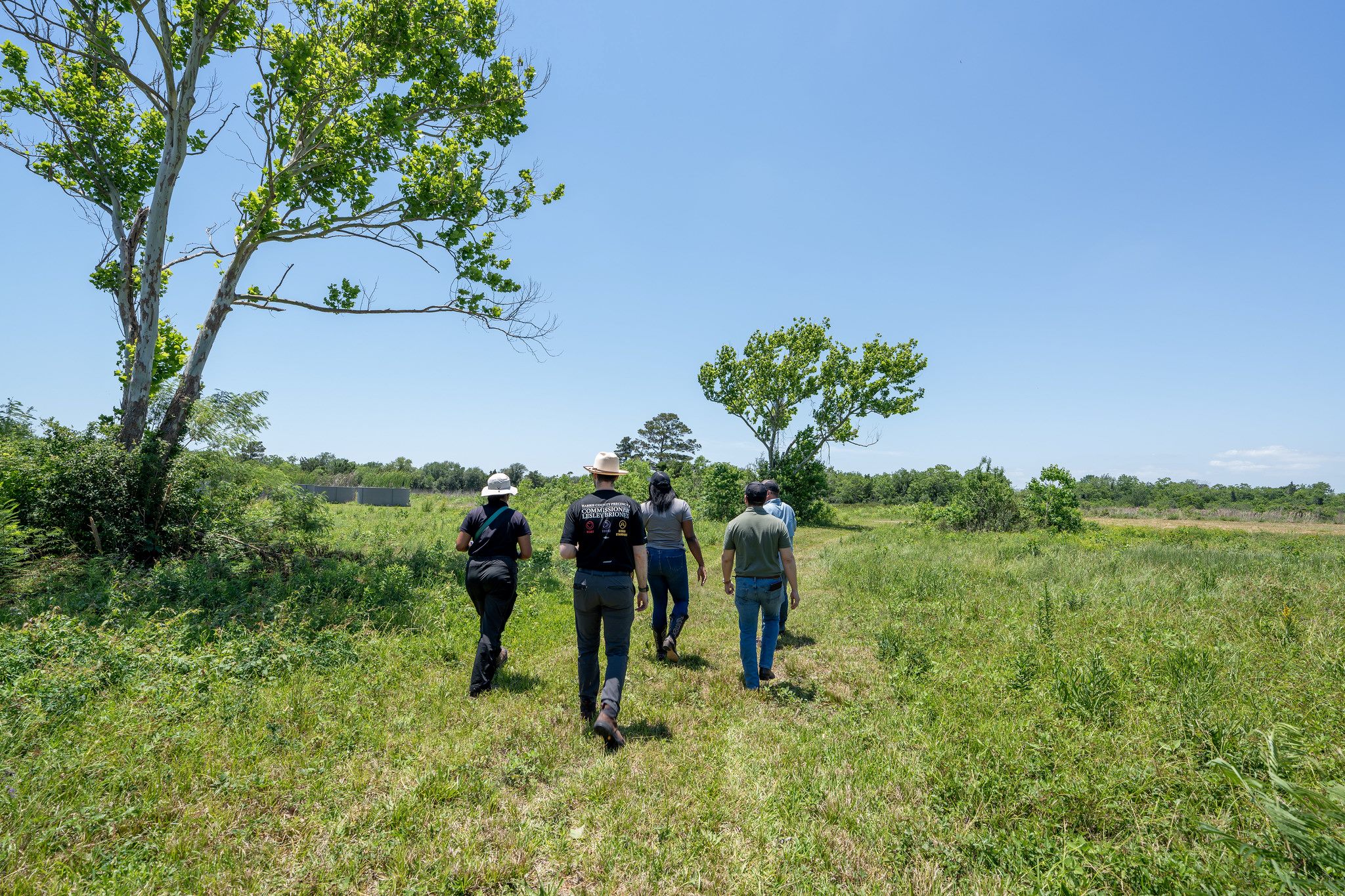 HCP4 operations team walking with Matthew Abernathy at the UH Coastal Center