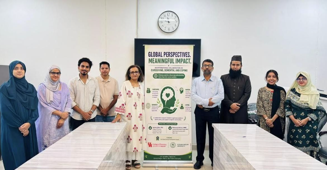 photo of Dr Salim and colleagues at AMU