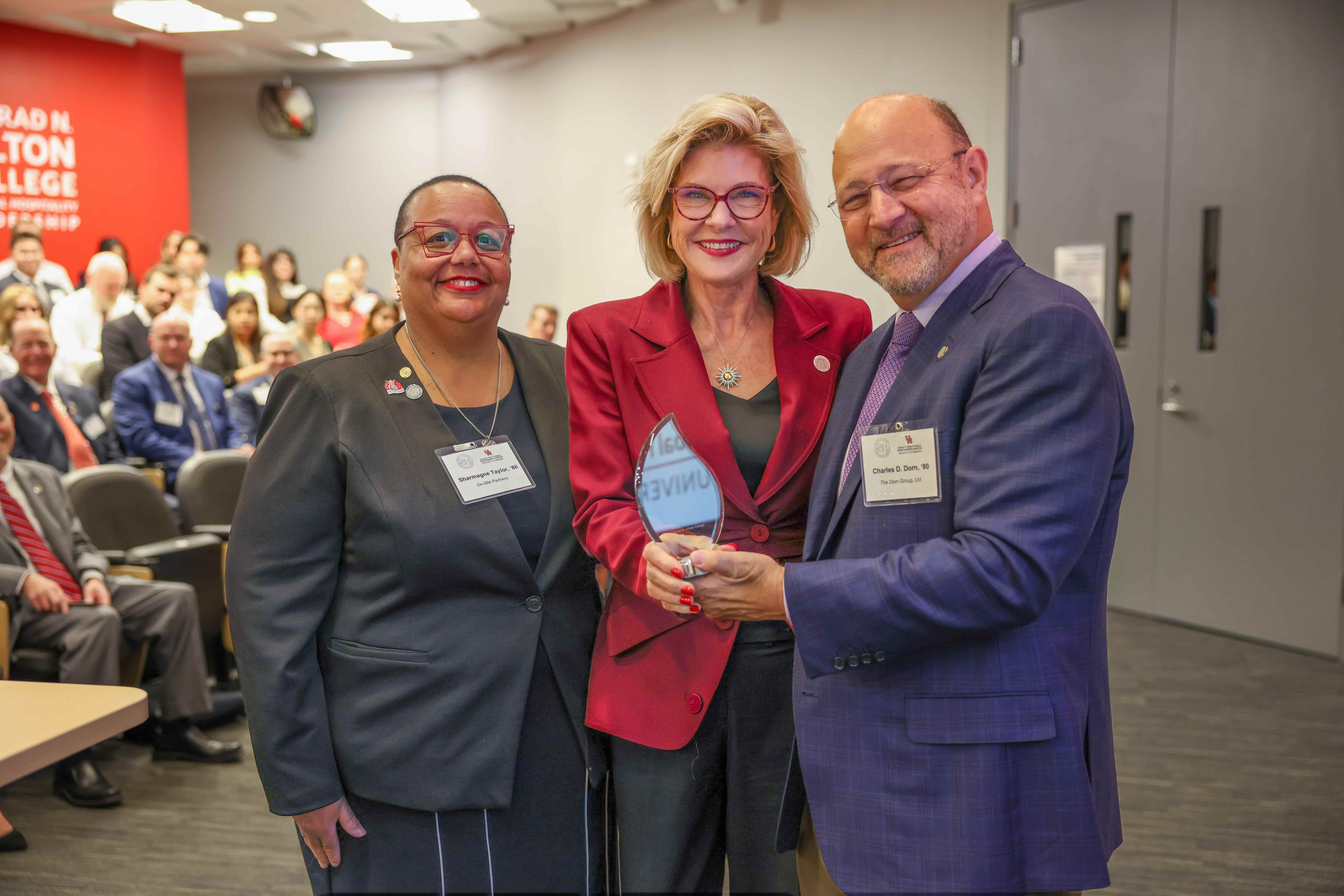 Linda Hilton poses for award