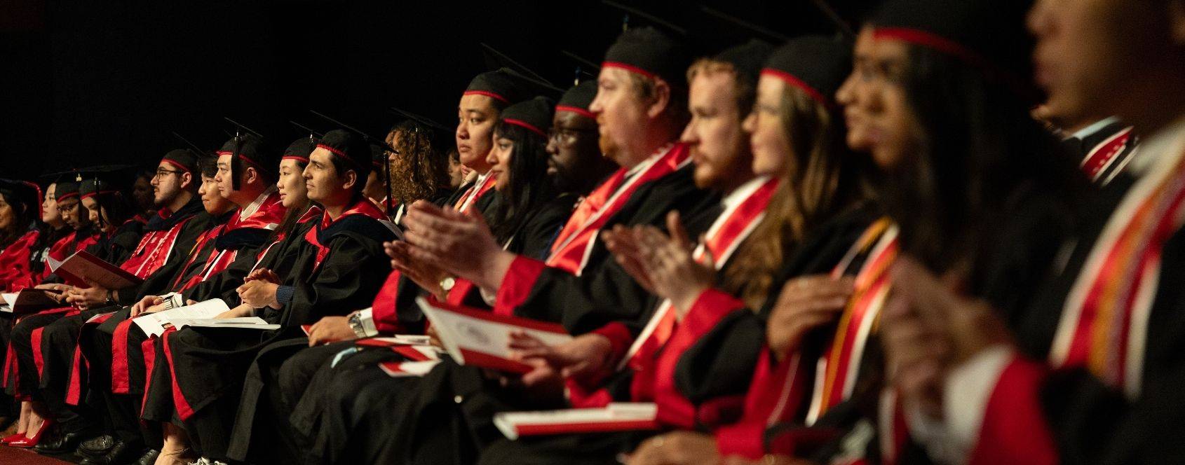 Graduate students sitting down