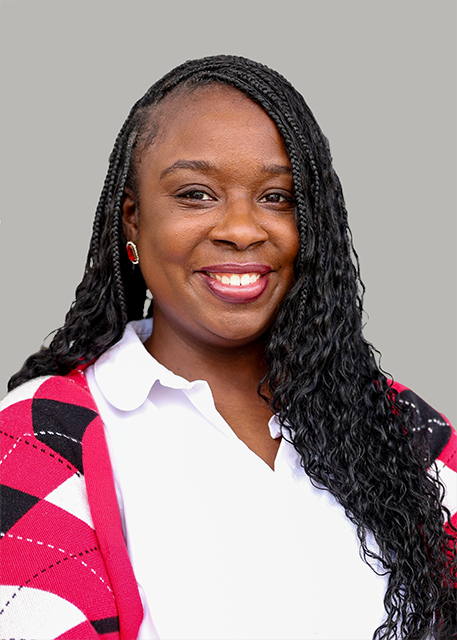 lady in a red, white, and black cardigan with long black hair