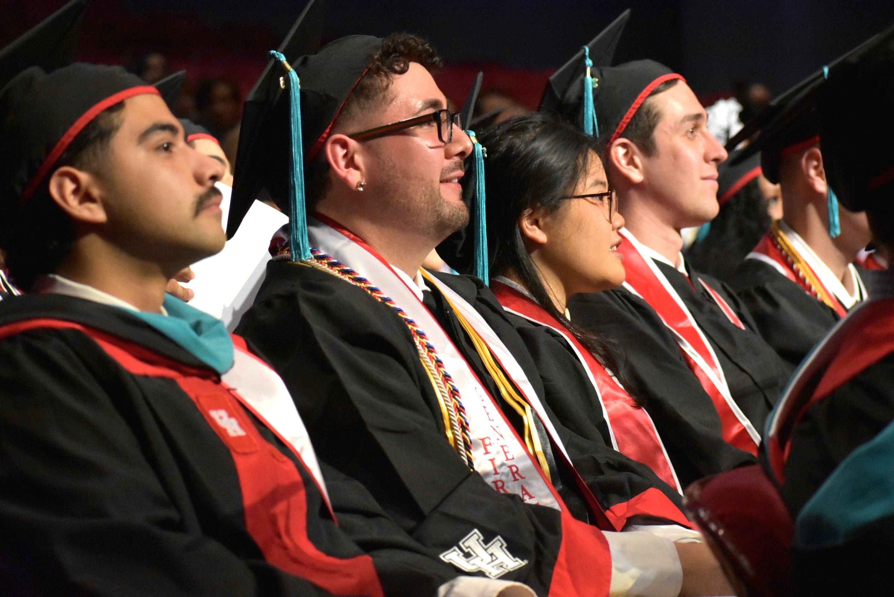 Students in cap in gowns during graduation