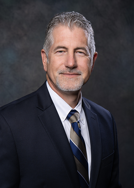 older white man in a business suit 