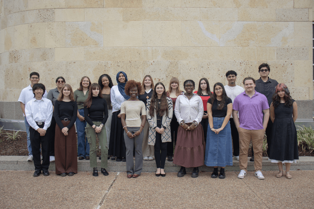 The 2026 Mellon Scholars cohort standing together as a group outside