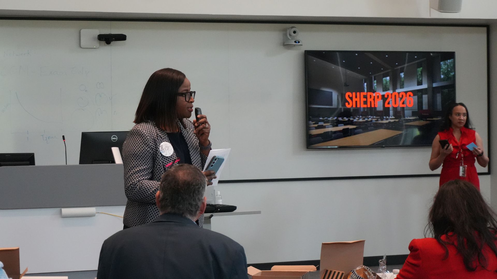 Lola Adepoju, Ph.D., M.P.H. director of Humana Institute at UH addresses the crowd at the SHERP competition.