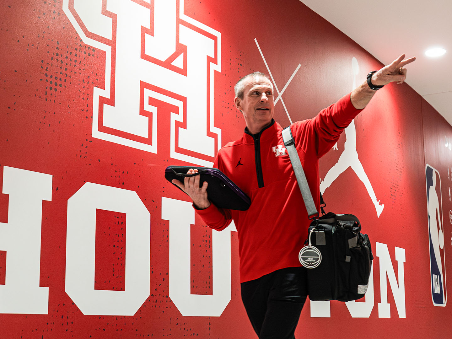 John Houston pointing in the Fertitta Center tunnel.