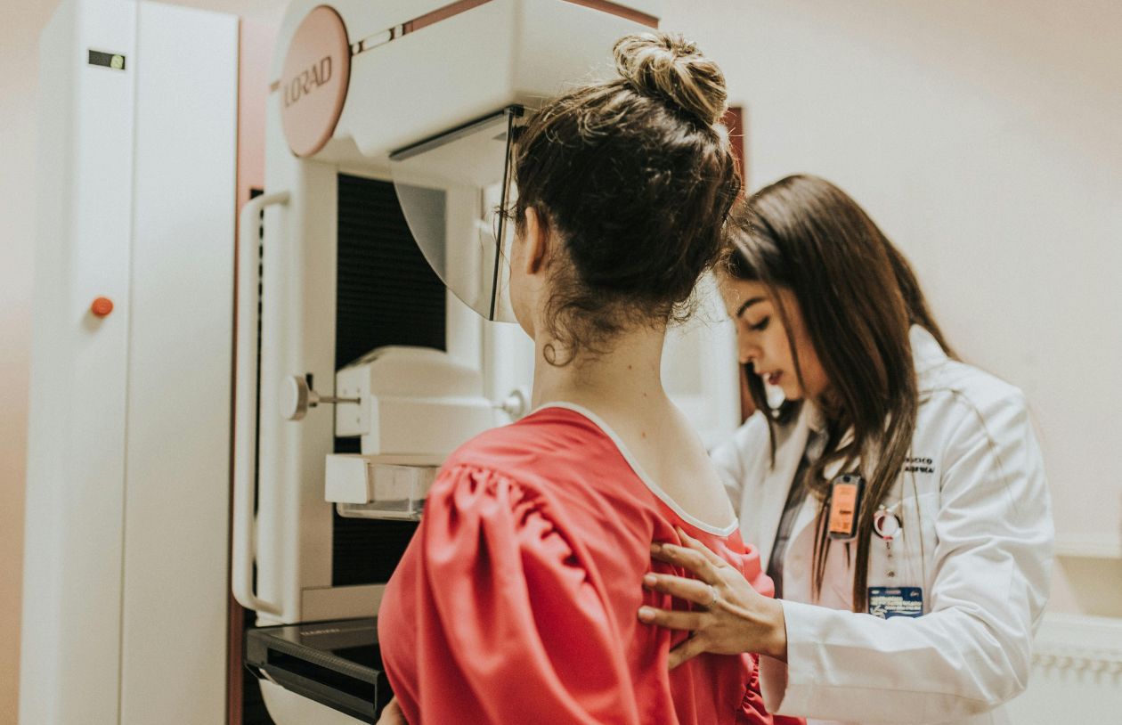 Young woman is having mammography examination at the hospital or private clinic with a professional female doctor.