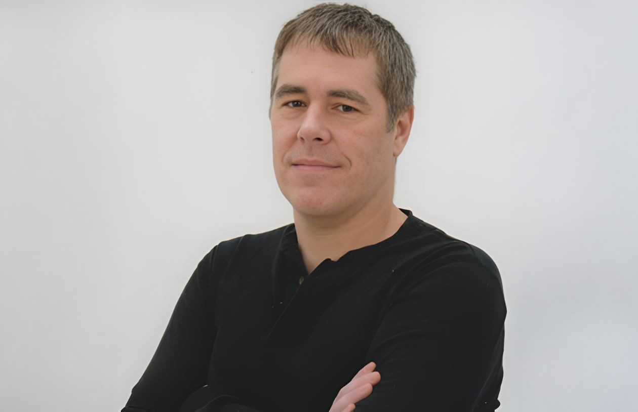 Michael C. Gibson with his arms crossed.