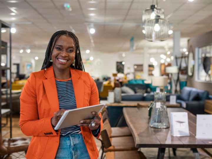 Photo of retail manager checking store inventory