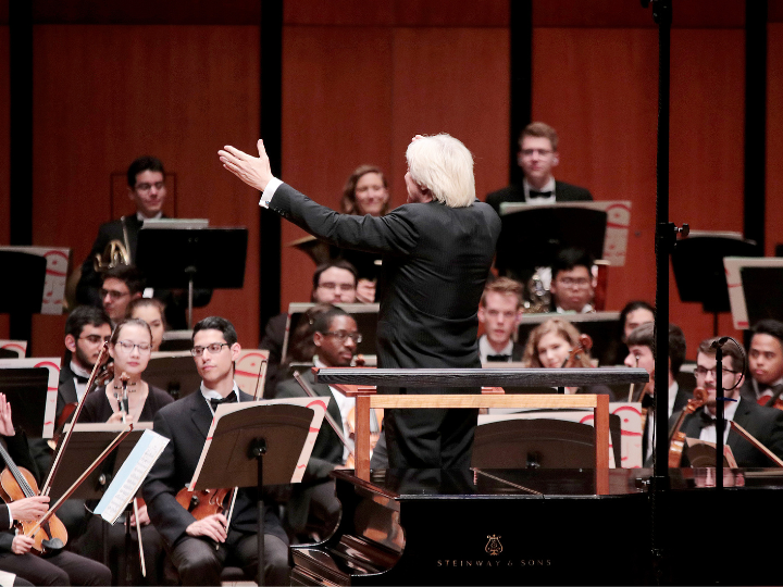 Conductor leads orchestra