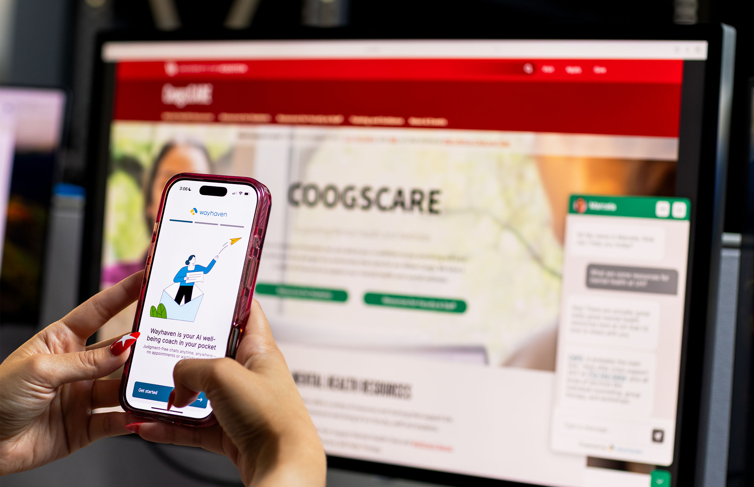 hand holding iphone with wayhaven app with coogscare website in background