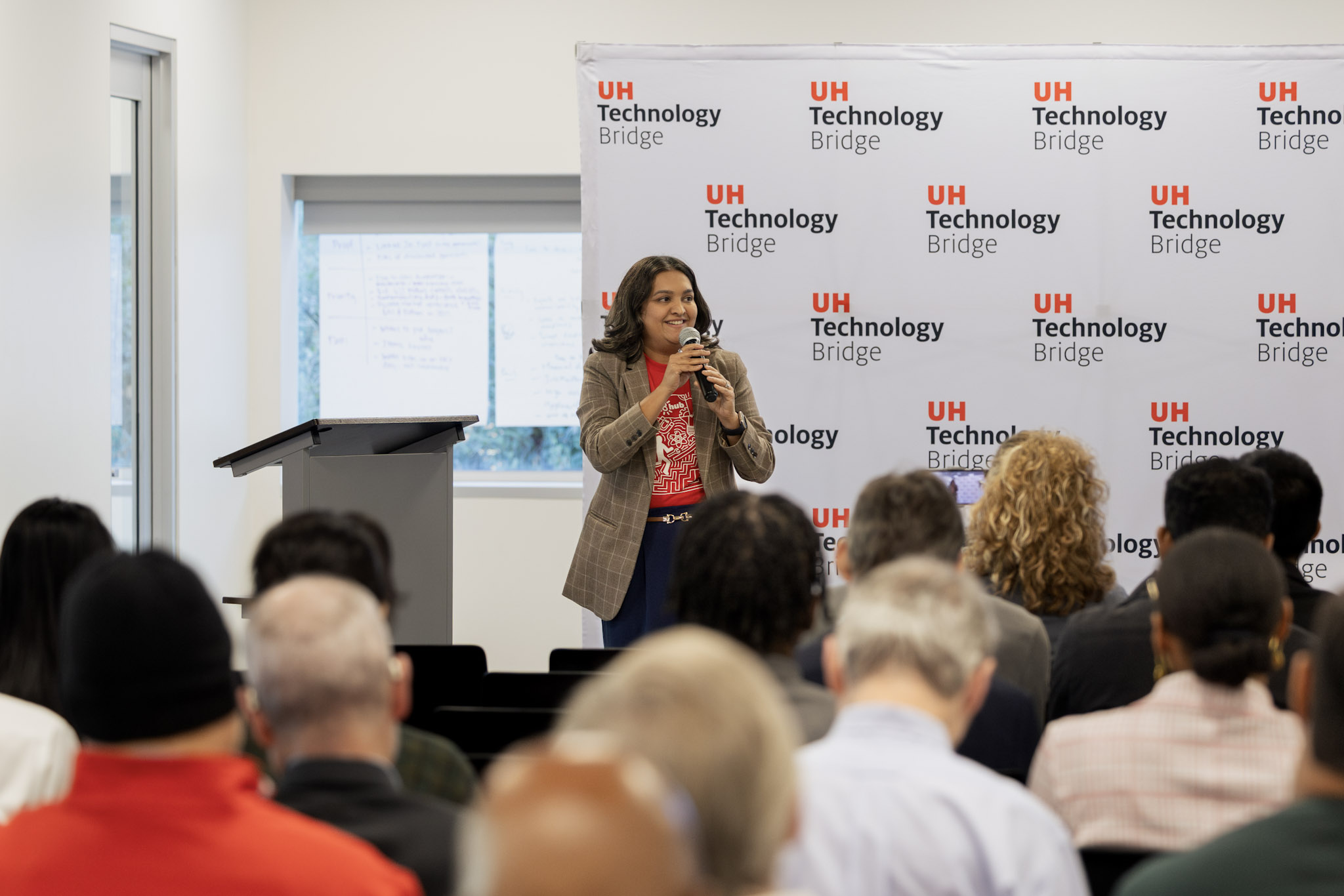 This is an image of Tanu Chatterji speaking to an audience.