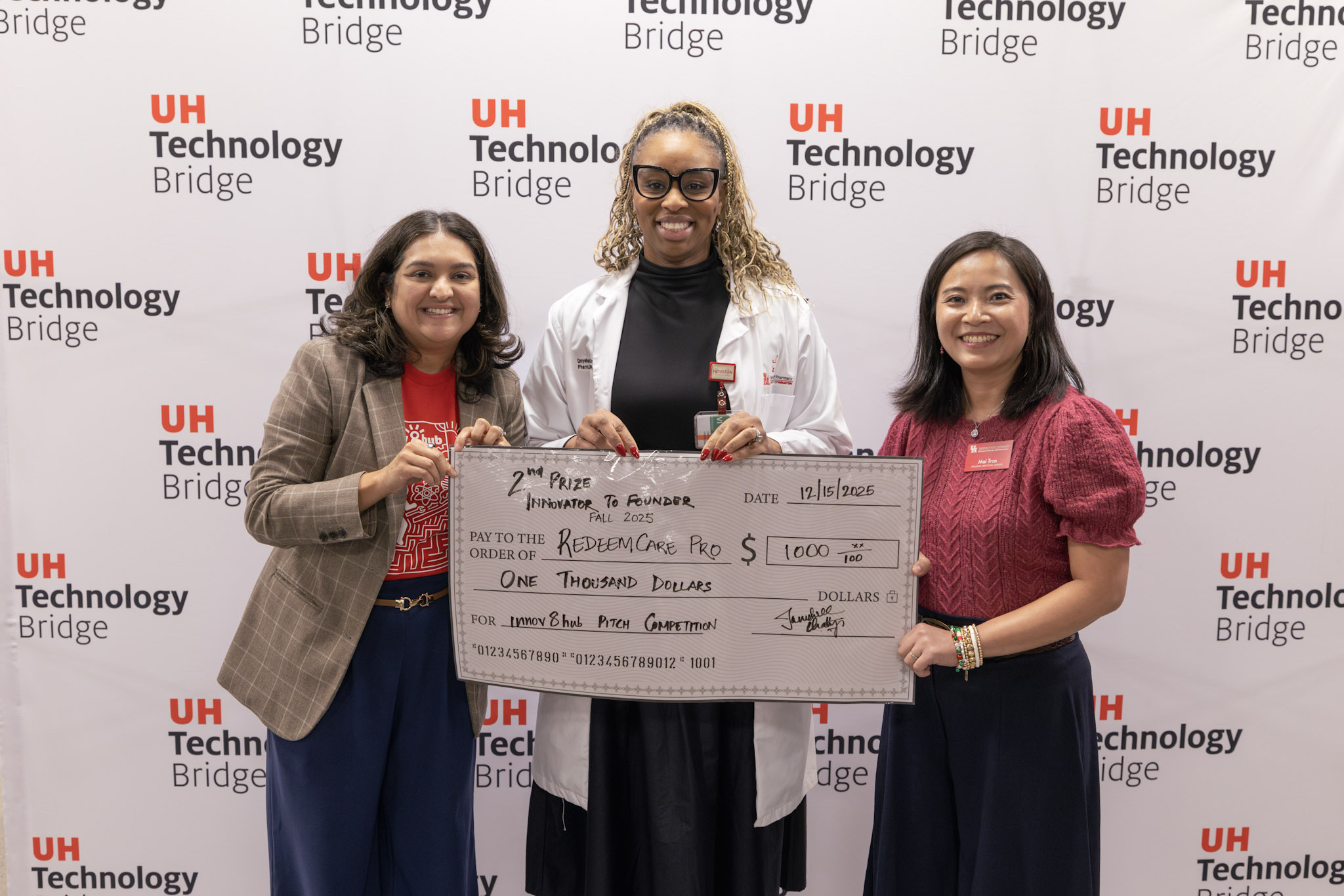 This is an image of Onyebuchi J. Ononogbu receiving her second-place prize.