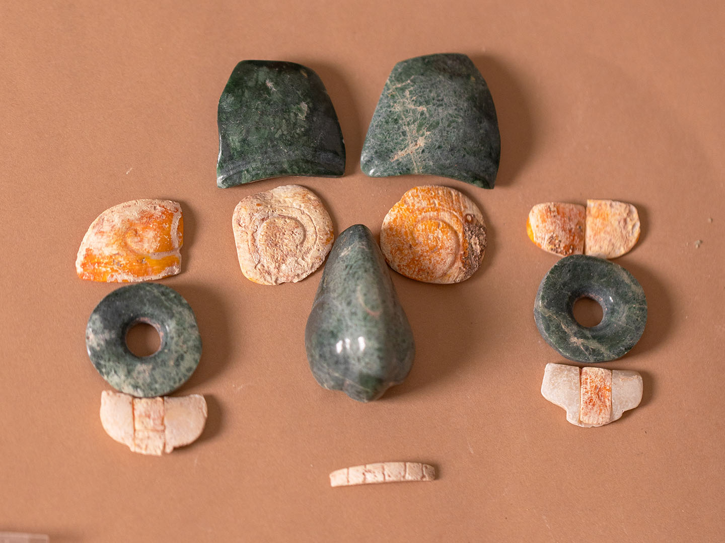 Pieces of an ancient ruler’s mask arranged on a table