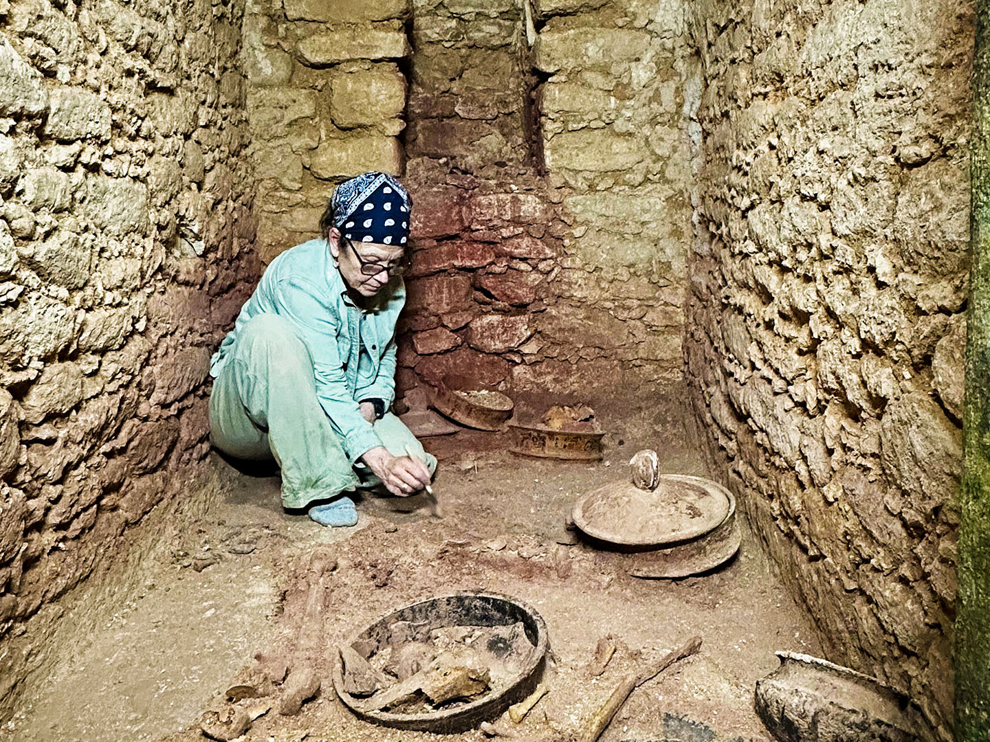 Archaelogist Diane Chase working in tomb