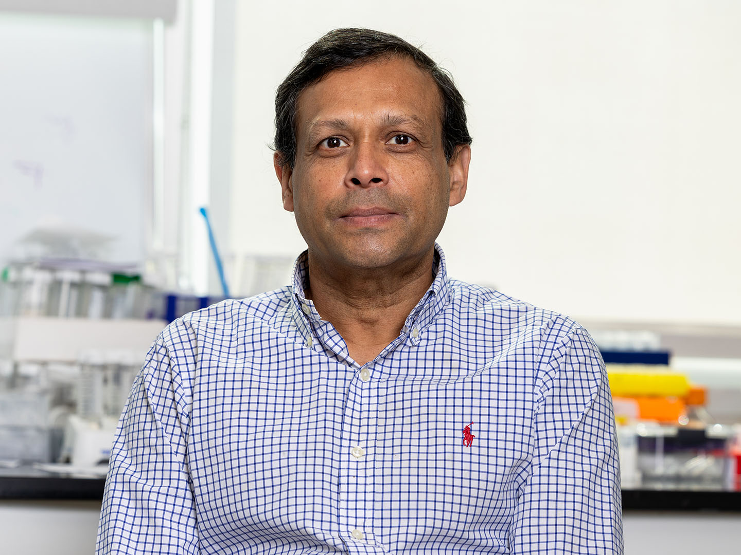Professor Alamgir Karim, Professor of Chemical and Biomolecular Engineering, sitting in a lab.