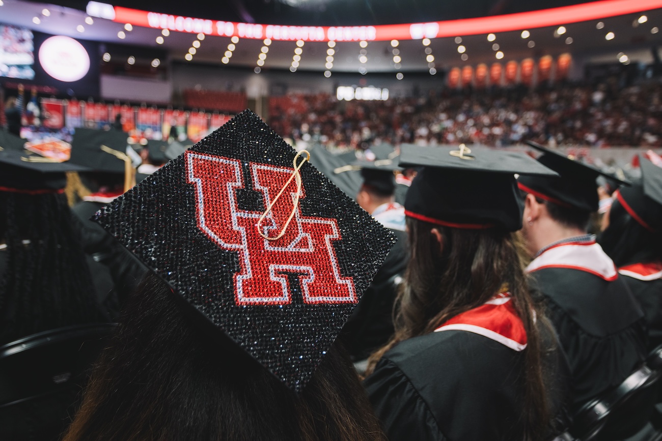 College of Liberal Arts and Social Sciences May 2025 graduation cap with UH logo on it
