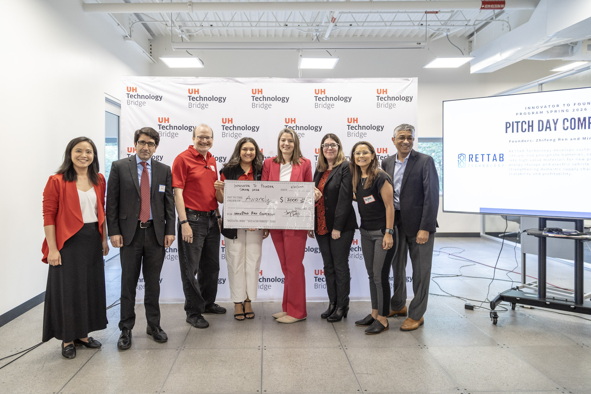 This is an image of the Innov8 Hub Pitch Day Winner receiving her award.