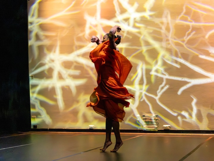 image of kgmca student dancing in front of a screen