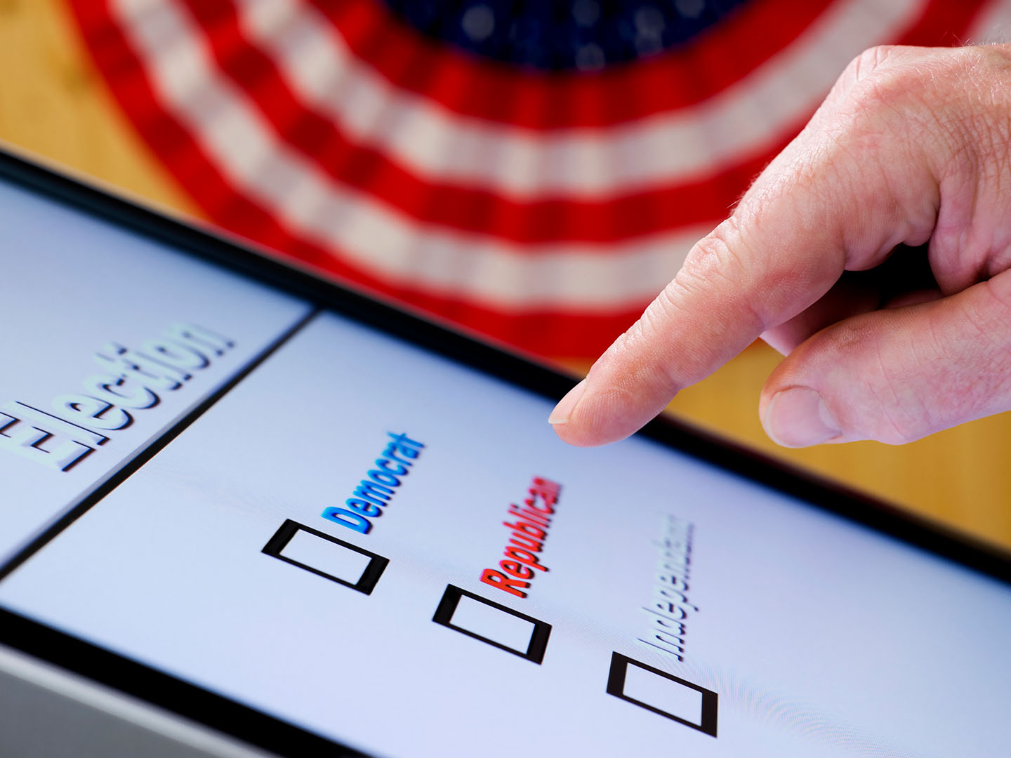 Finger hovering over republican button on ballot