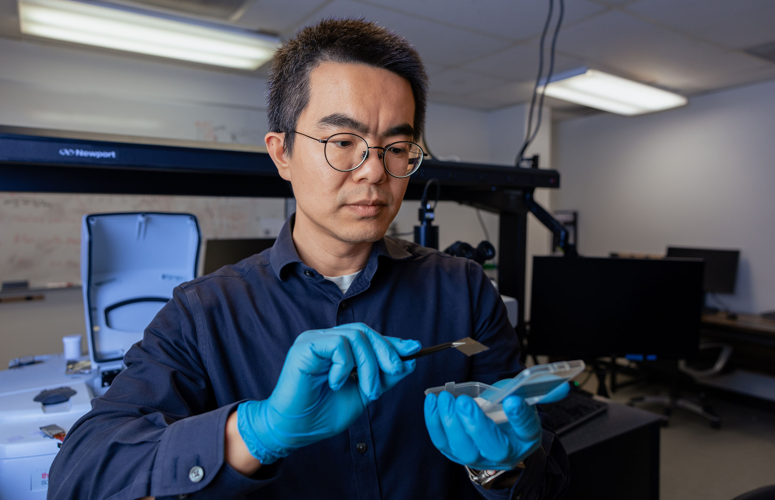 Professor Bo Zhao showcasing his heat regulating technology.