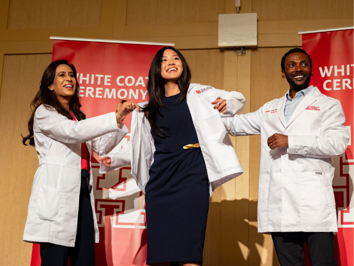 new medical students receiving white coats