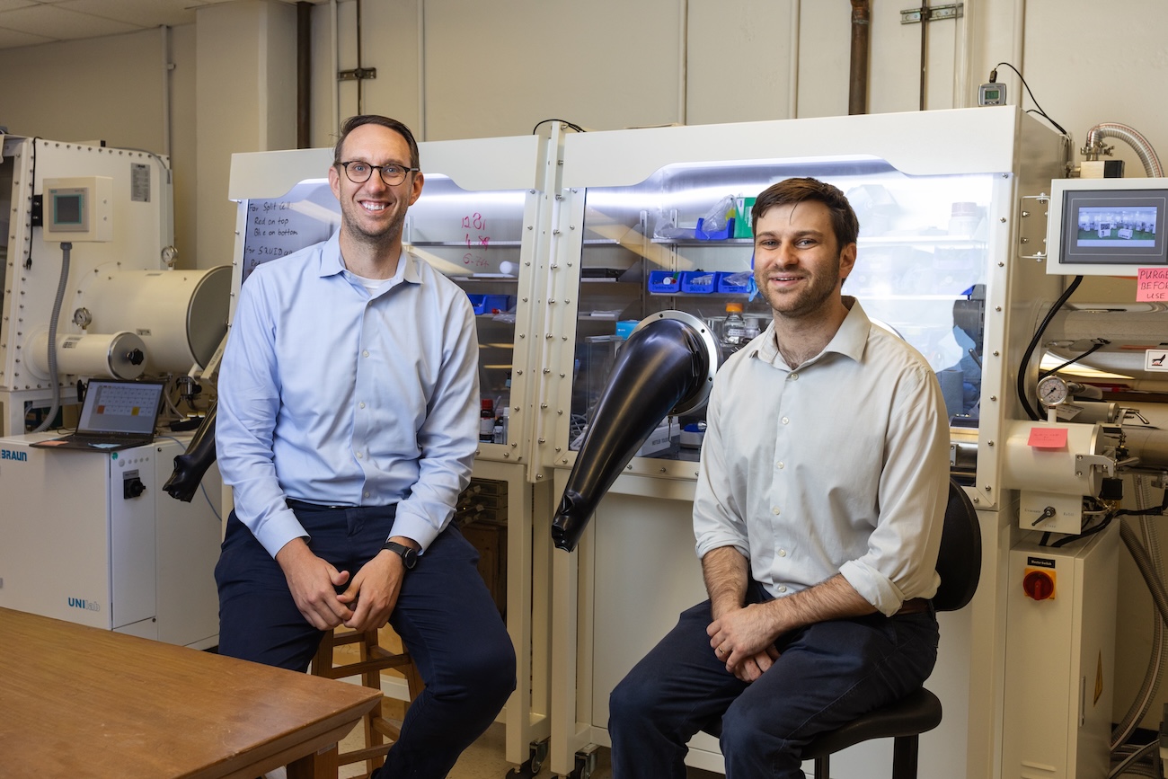 uh professors jakoah brgoch and Joshua Bocarsly sit in a uh lab