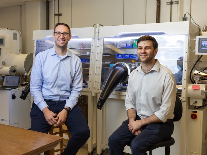 uh professors jakoah brgoch and Joshua Bocarsly sit in a uh lab
