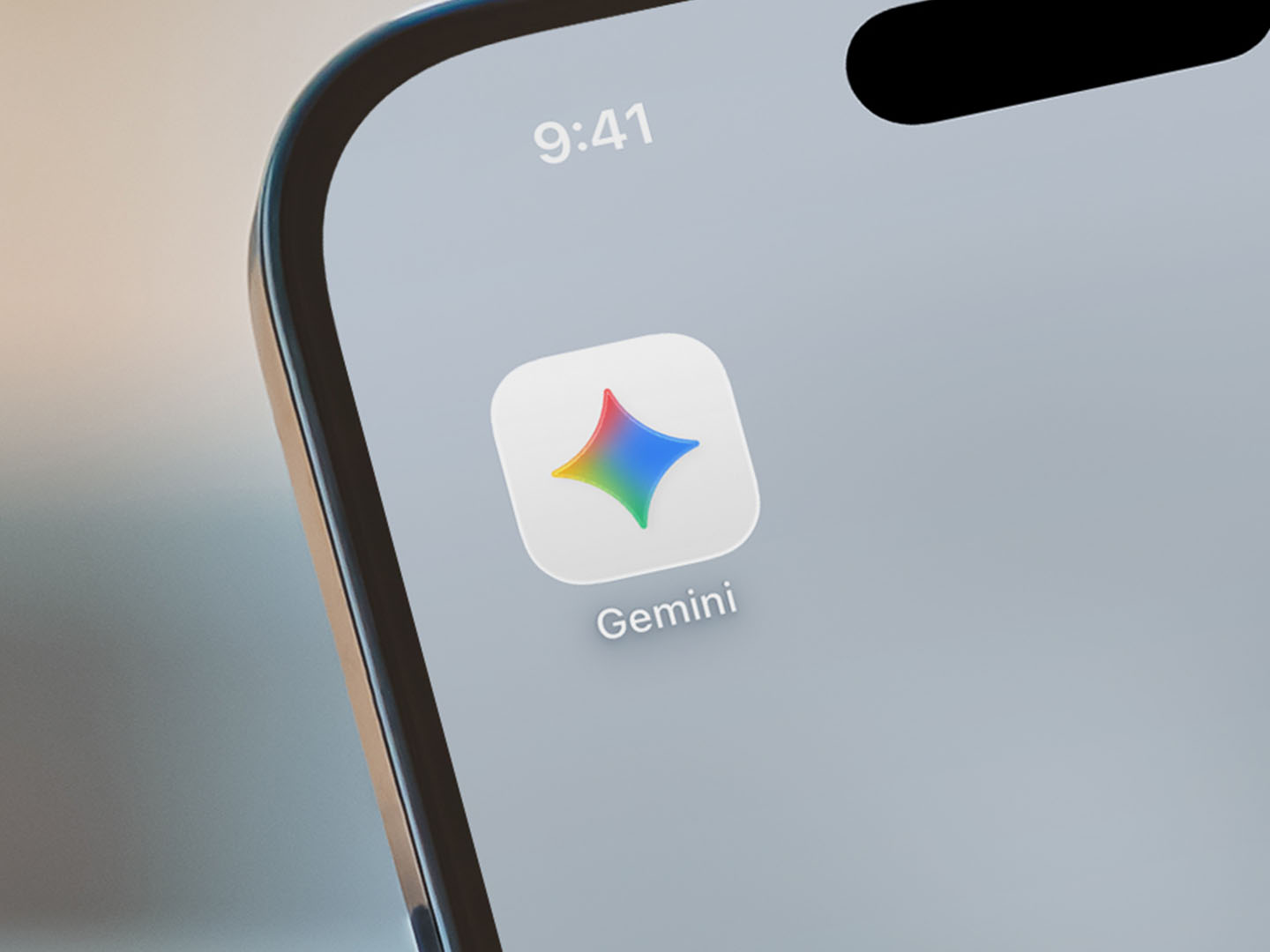 Close-up of a smartphone with Google Gemini app on home screen.