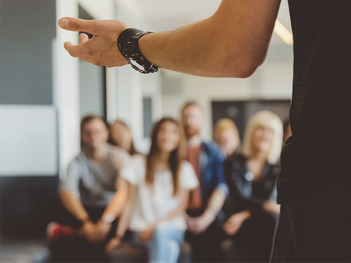 Presenter in front of audience.