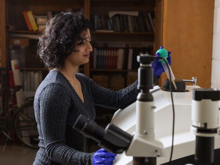 Graduate student Anuska Pudasaini — a student who works in Wellner's UH lab — places a marine sediment sample inside a laser particle size analyzer. 