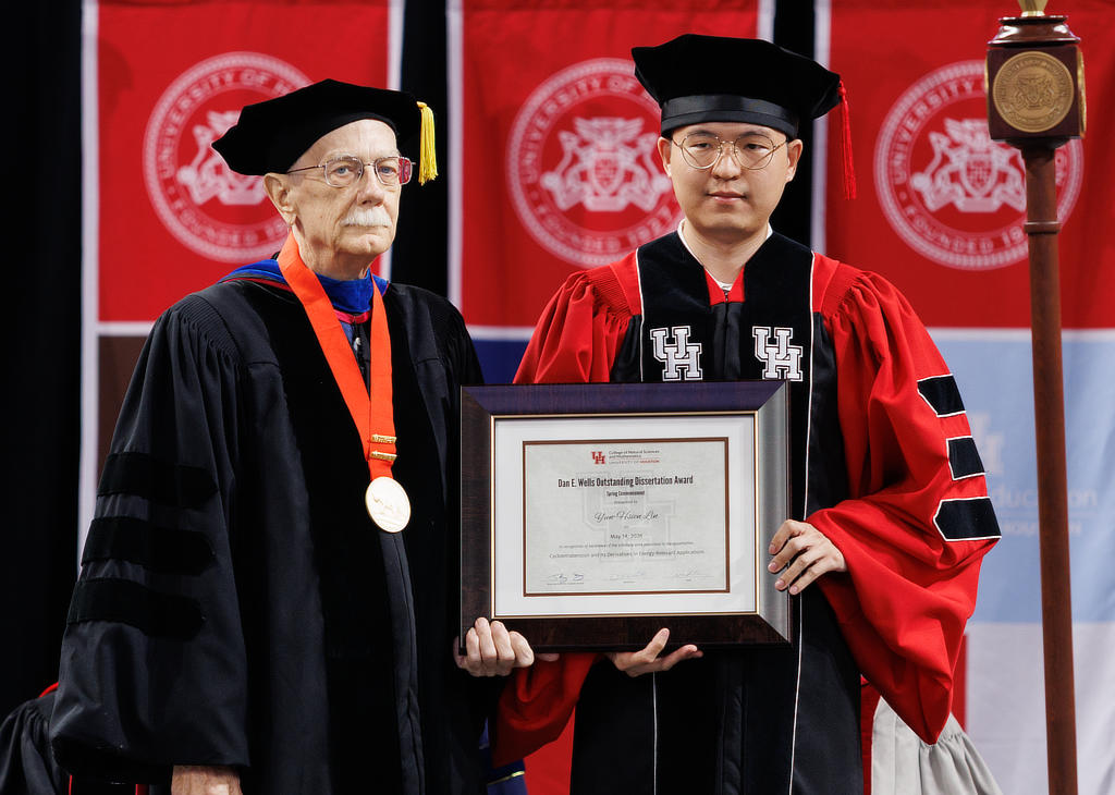 Dan E. Wells Outstanding Dissertation Award winner Yun-Hsien Lin with former Dean Dr. Dan E. Wells (left).