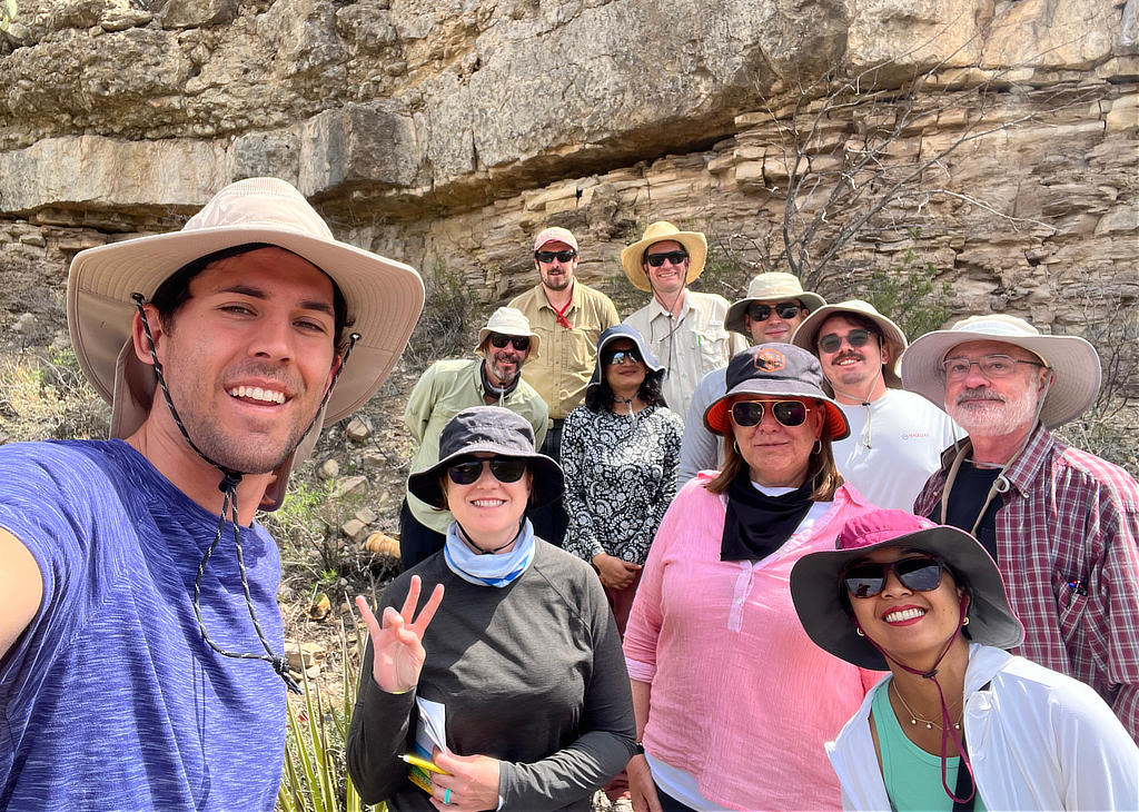 The field group selfie at Last Chance Canyon. Top row - left to right: Daniel Lavery and Dr. Kevin Hobbs (New-Mexico Bureau of Geology and Mineral Resources), Middle row: Ary Candido, Anuska Pudasaini, Breno Goldenberg Araujo, Ilia Tarasevich, and Kurt Rudolph, Bottom row: Bradley King, Jamie Jetton, Dr. Julia Wellner, and Munirah Zulkifli. (Image Credit: Julia Wellner)