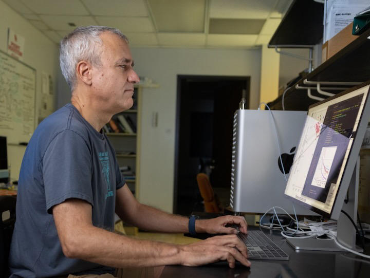 UH Professor Ricardo Azevedo, principal investigator of the grant, reviews data on this computer.