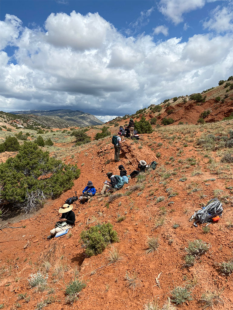 Students taking measurements of an outcrop. Photo Credit: Jack McLaughlin, TA