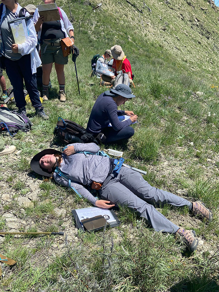 Student Nathalie Devoir takes a rest after completing the death march. Photo credit: Jack McLaughlin, TA