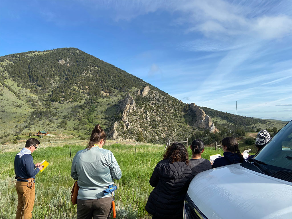Students (and Professor Alex Robinson) sketch Towne Point Mountain. Photo credit: Jack McLaughlin, TA