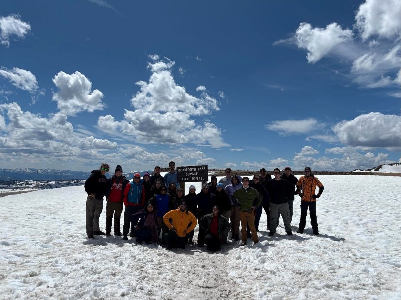 Obligatory post snowball fight group photo in front of the elevation sign. Photo credit: Alex Robinson, Professor