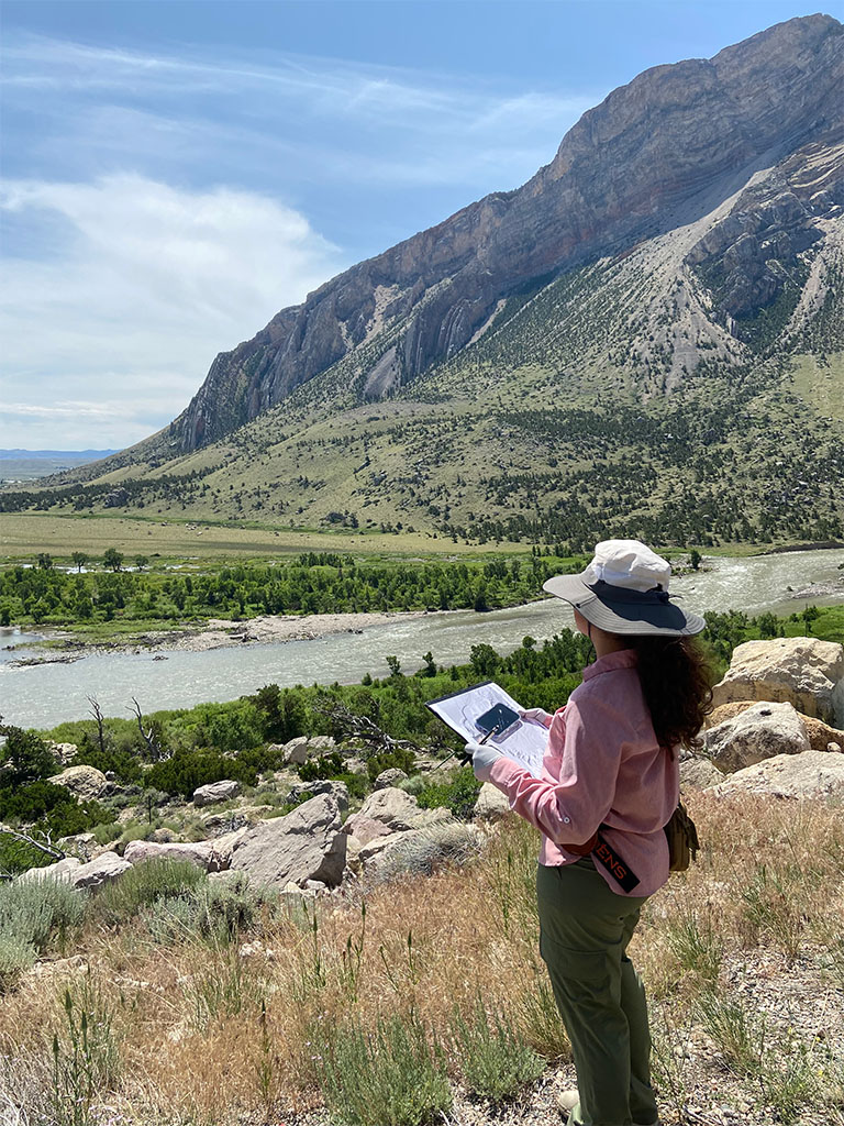 Student Keren Padilla considers the geomorphological processes that have led to the terrain before her. Photo credit: Jack McLaughlin, TA