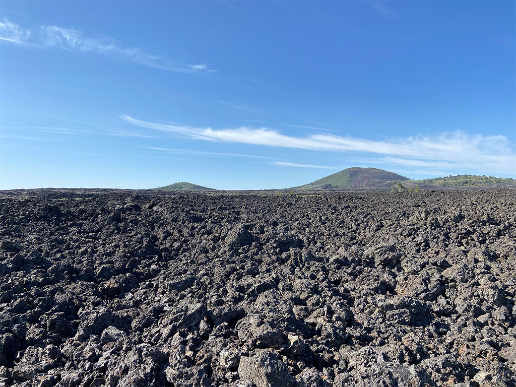 A typical view at Craters of the Moon of the otherworldly landscape caused by basaltic lava flows. Photo credit: Jack McLaughlin, TA