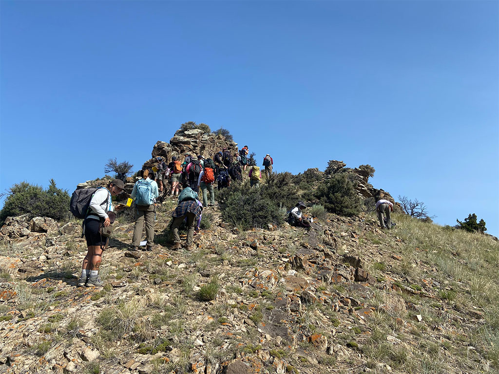 Students at the first outcrop at Block Mountain taking measurements and writing down lithologic descriptions. Photo credit: Jack McLaughlin, TA