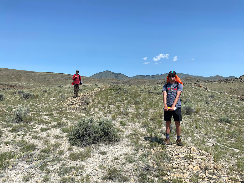 TA Abe Masaryk (left) and student Robert Leenhouts (right) showing the apparent offset of an outcrop due to a small-scale fault. Photo credit: Jack McLaughlin, TA