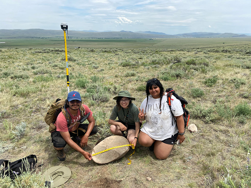 Students proudly show the largest rock they unearthed from their soil pit (I had to help them haul it out). Photo credit: Jack McLaughlin, TA