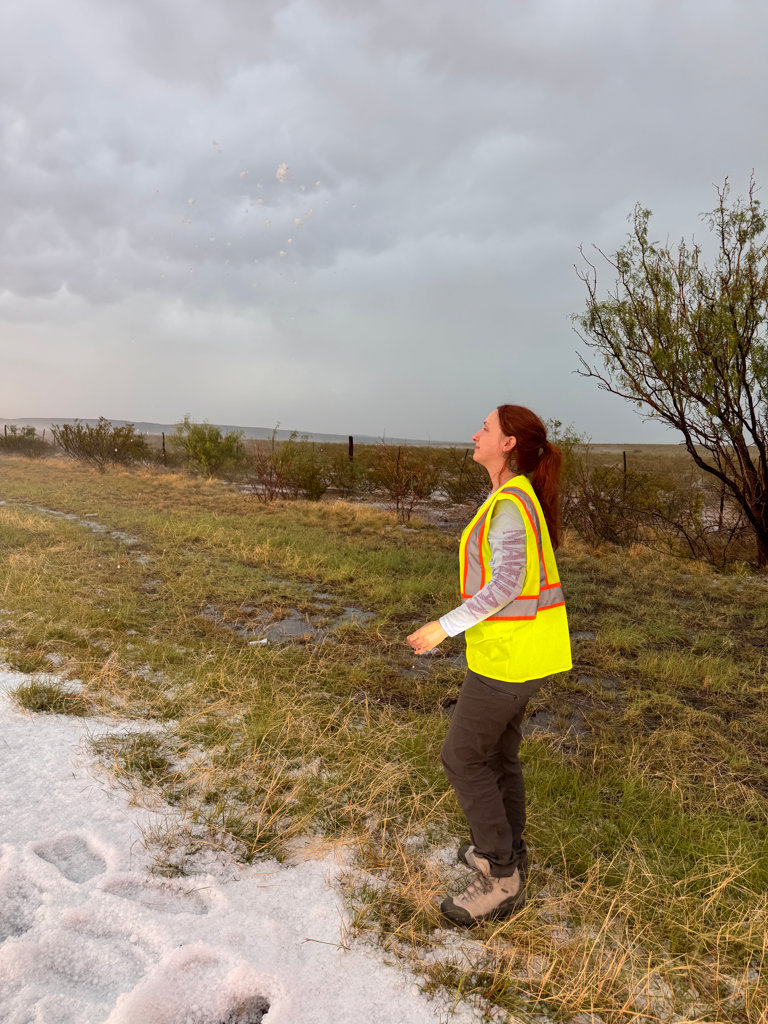 Students enjoying the hail after the storm, with a spectacular orange sunset lighting up the sky later that evening.