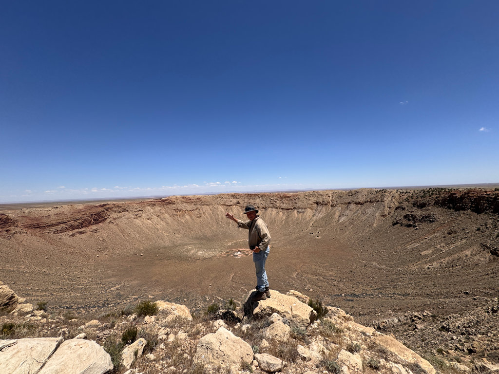 Dr. Robert Stewart, Professor of Geophysics at the rim of the meteor crater.