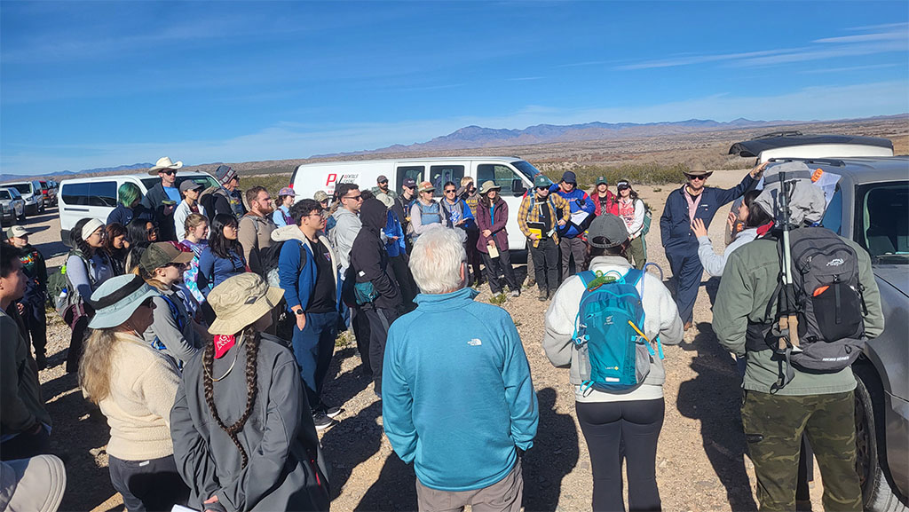 Dr. Brandee Carlson and her undergraduate researchers give geological overview of Elephant Butte Reservoir before we begin. Photo credit: Korien Oostingh